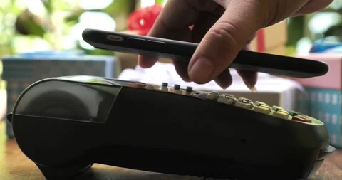 Payment made with smartphone using nfc system mobile phone on cash machine Stock-Footage 336585683