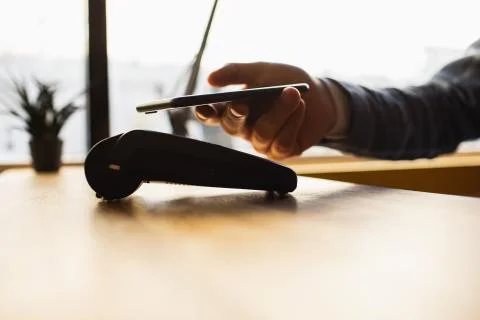 Payment made with smartphone using nfc system and contactless card. Photos