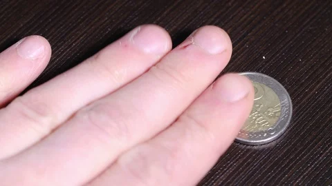 Payment with metal coin face value of one euro Coins are laid on takes hand Video stock 127197700