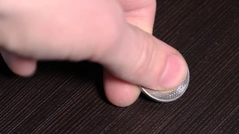 Payment with a metal coin. face value of one euro and two euros. Video stock 127197821