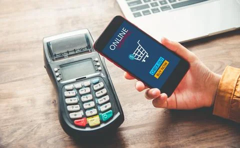 Payment with NFC technology by mobile phone. Modern cashless payments. Stock Photos
