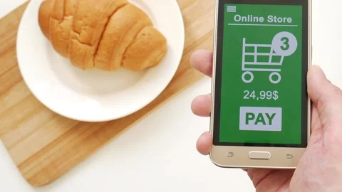 Payment online via smartphone during breakfast Stock Footage 106893378