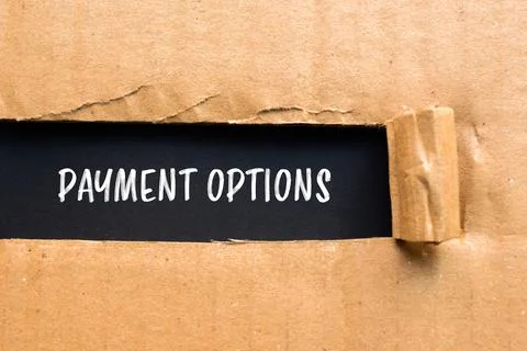 Payment options message written on ripped torn cardboard paper with black bac Fotos Stock