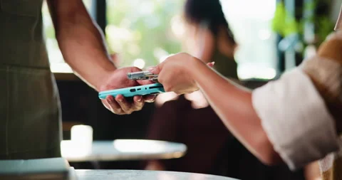 Payment, phone and hands in cafe with pos machine, eft service and transfer in 動画素材 331002394