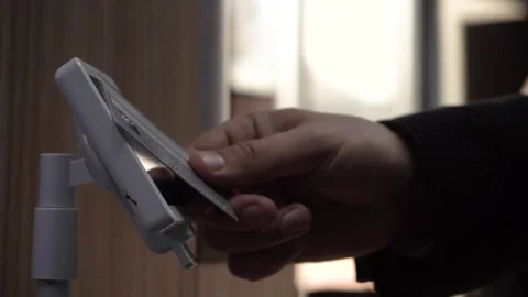 Payment by plastic card in a cafe at the POS terminal Stock Footage 288374023