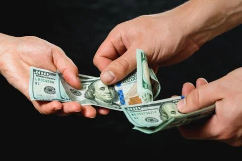 Payment of services, receiving bribes, exchange for information, Dollar bills 스톡 사진