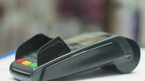 Payment via smartphone using NFC technology. Close-up, concept of mobile payment Stock Footage 84124014