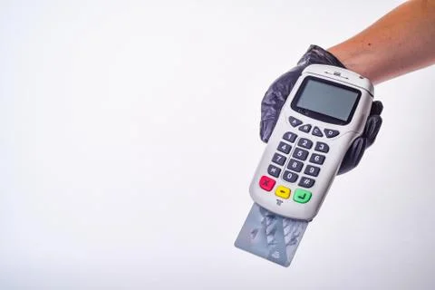 Payment terminal. Hand in glove. Safe shopping concept Stock Photos