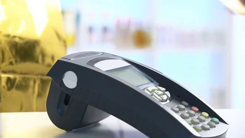 Payment in a trade with nfc system and contactless card. Slow motion Stock Footage 73237475