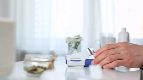 Payment transactions with a smartphone through the terminal. Customer pays using Stock Footage 130056425