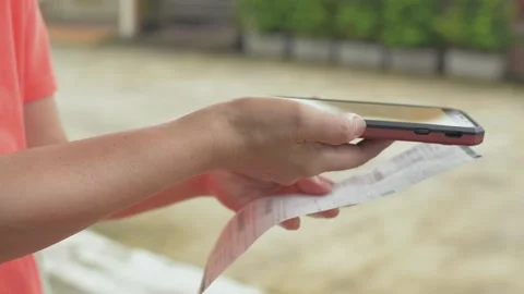 Payment of utility using Bar code with mobile device for electricity bill. Video stock 154672065