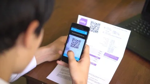 Payment of utility using QR code and mobile device Stock Footage 121903553
