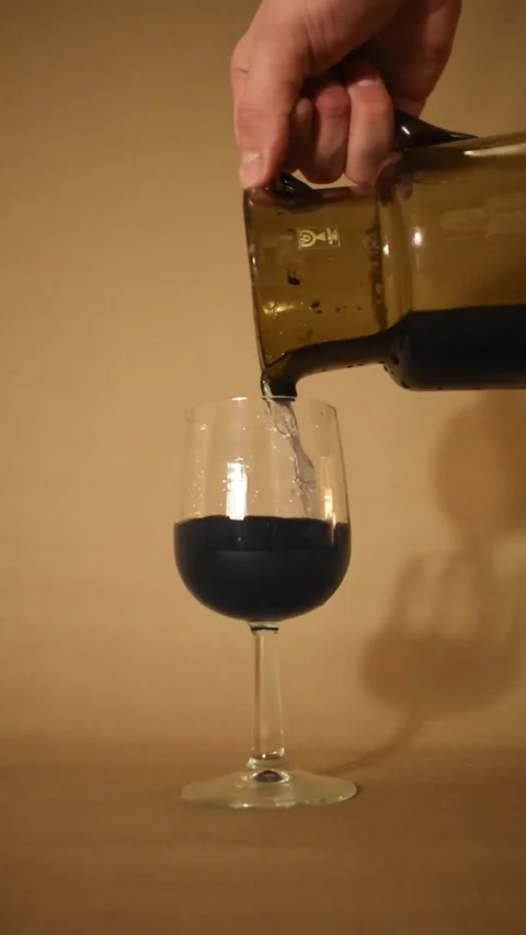 Payne's grey colored liquid in vine glass Stock Footage 227518441