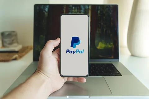 Paypal internet banking application logo in front of laptop Stock Photos