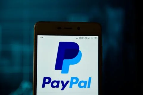 Paypal logo is seen on an android smartphone Stock Photos