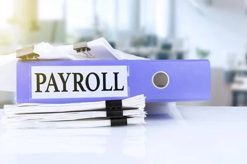 Payroll, the term is written on a folder of documents in trendy purple, lying Stock Photos