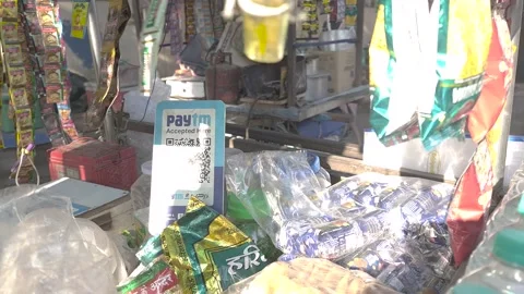 PAYTM QR code scanning point displayed at a very small street vendor of Delhi Stock Footage 238791590