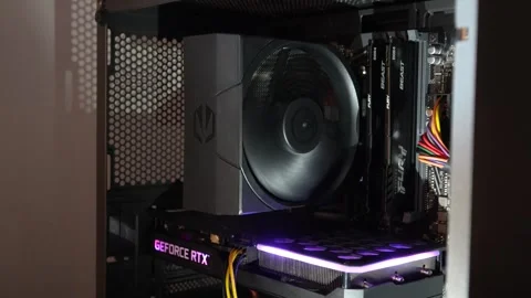 PC build interior with active cooling fan, RGB-lit GeForce RTX graphics card Stock Footage 320000913