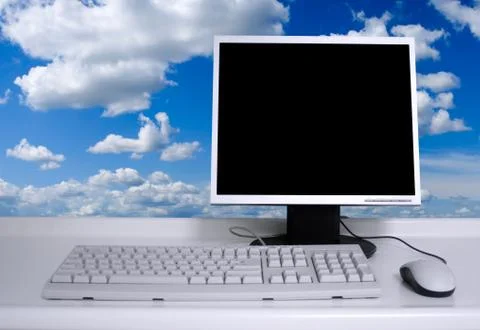 Pc with clouds background Stock Photos