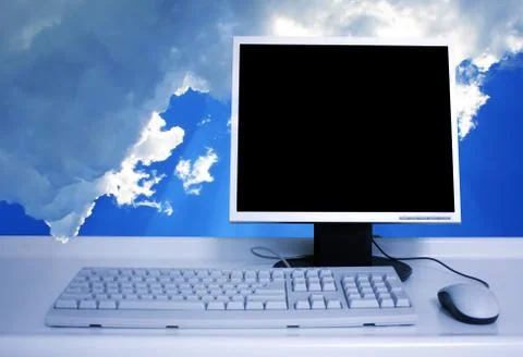 Pc with clouds background Stock-Fotos