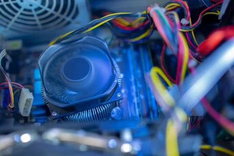PC components in dust. CPU fan is work. Dusty power wires Stock Photos
