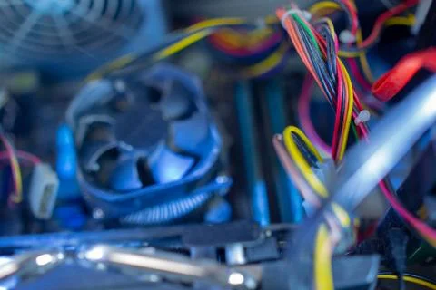 PC components in dust. Dusty power wires, CPU fan soft focus Stock Photos