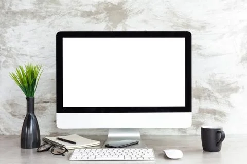 Pc computer on workspace table showing blank white screen Stock Photos