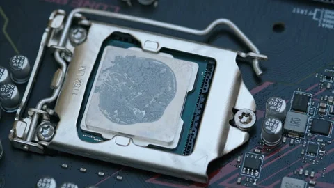 Pc cpu with dried thermal paste on hi tech motherboard,computer components chip Stock Footage 210182495