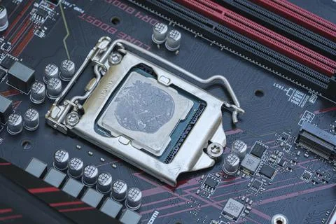 Pc cpu with dried thermal paste on hi tech motherboard,computer components chip Foto stock