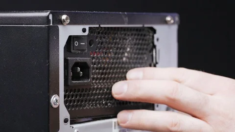 PC disassembly. A close-up of the service worker pulls the power supply out of Stock Footage 105569237