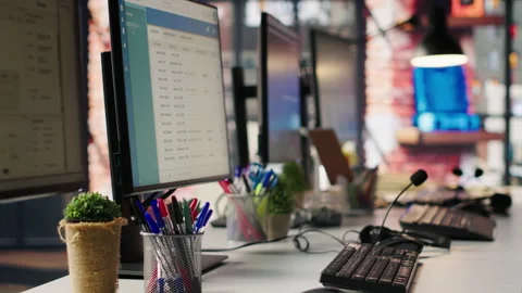 PC displays in empty call center office Stock Footage 305391826