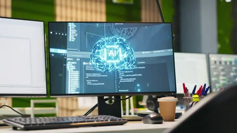 PC in empty IT startup office displaying artificial intelligence code Stock Footage 313016570