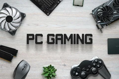PC gaming flat lay scene with text and gaming computer components and joypad. Stock Photos