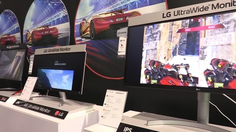 PC gaming monitors and high-end water-cooled computer in showroom Stock Footage 91825619