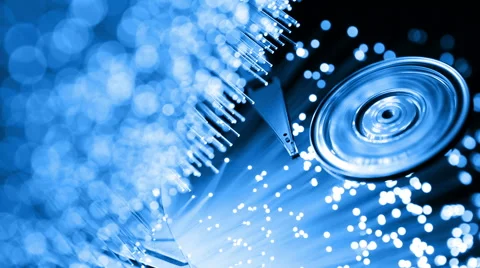 Pc hard disk with Fiber optics background, shot in HD Video stock 65823718