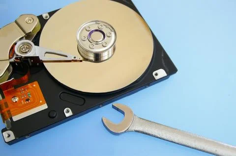 Pc hardrive and wrench, computer repair Stock Photos