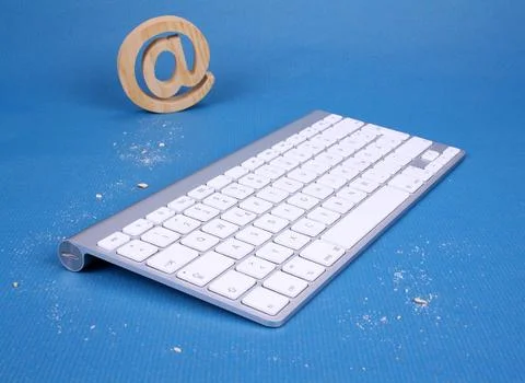 Pc keyboard on a blue background and cookies tracks Stock Photos