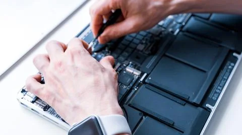 Pc repair. Maintenance engineer support. Computer technician service with lap Stock Photos