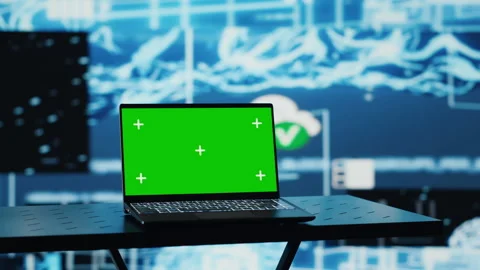 PC running green screen on a display surrounded by high tech data AI brain Stock Footage 311134100