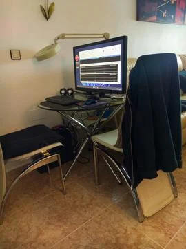 PC workstation area on table in appartment Stock Photos