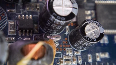 PCB Closeup Electronic Components Through-Hole Plating Capacitor SMD Chip Video stock 117067320