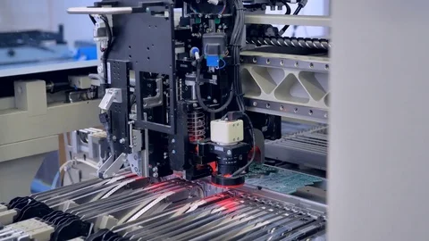 PCB machine picking up tiny chips. Stock Footage 78591559