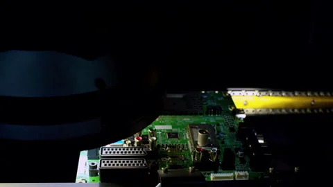 A PCB moving under stroboscopic flashes.Automated optical inspection Video stock 337474836