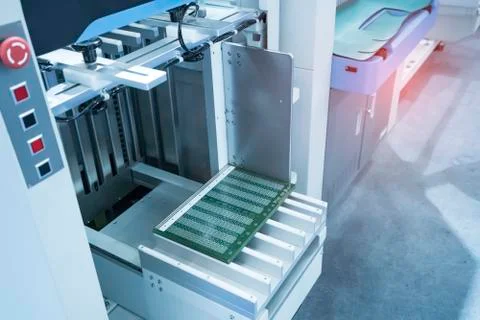 PCB Processing on machine working in factory Stock Photos