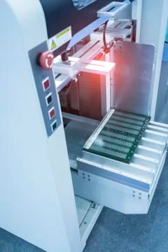 PCB Processing on machine working in factory Stock Photos