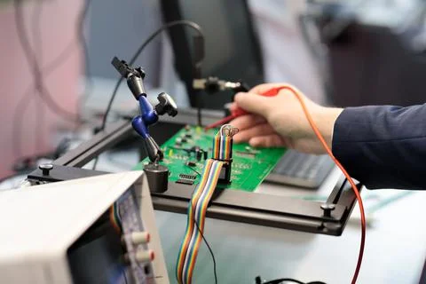 PCB testing and quality control with oscilloscope Stock Photos
