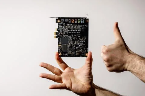 PCI Express card for computer in hand, audio chip Stock Photos