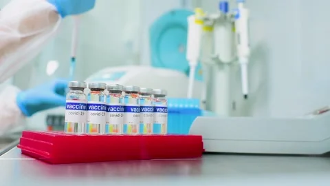 PCR lab worker creates a vaccine against covid-19 coronavirus infection. Stock-Footage 148282369