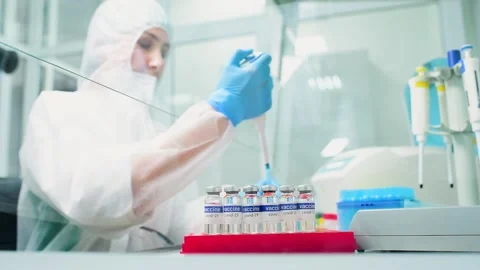 PCR lab worker creates a vaccine against covid-19 coronavirus infection. Stock-Footage 148282421