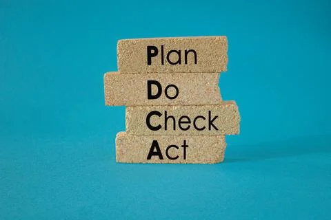 PDCA symbol. Brick blocks with the words PDCA. Stock Photos